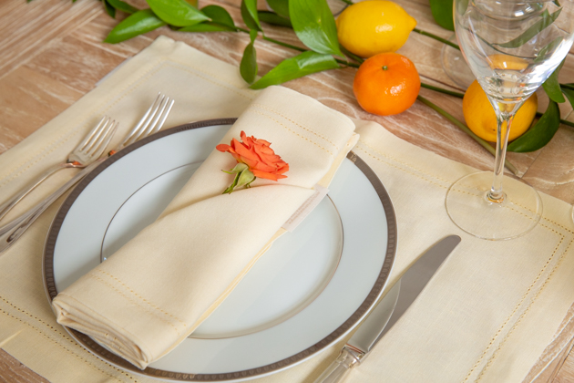 Setting the table for a Spring Dinner Party, Williams Sonoma Linen Napkins, White Dishes, Yellow Placemat