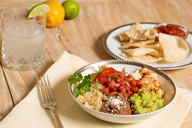 Mucho Delicious Bowl, Ahiote Chicken, Quinoa, Refried Beans, Guacamole, Pico de Gallo, Sauteed Bell Peppers and Onions