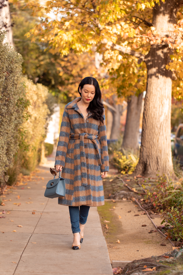 Statement coat styled by top Los Angeles fashion blog, Pretty Little Shoppers: image of a woman wearing an Urban Outfitters plaid wool statement coat. | It's All About the Coat, Plaid Coat, Urban Outfitters Coat, How to style a Statement Coat, Winter Fashion, Winter Style, Shop till you drop, Nuuly Rental Service, Joseph and Stacey, Anthropologie Blouse, Wool Coat, Who What Wearing, Mad About Plaid, Fashion Blogger Style, Outfit Inspiration, Street Style, Street Fashion, OOTD Inspo, Street Style Stalking, Seasonal Style #mynuuly #fashionblogger #lafashionblogger #streetstyle #Winterfashion #StatementCoat #WinterCoat