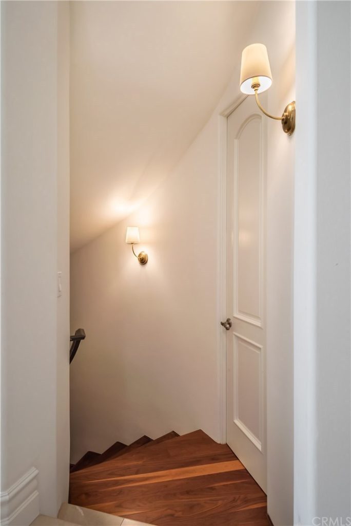 Basement Stairwell Sconces After, Lighting Makeover with Visual Comfort, Home Remodel, Lighting Fixtures Before and After, Visual Comfort Lighting, Chandeliers, Sconces, Home Makeover, House Update, Luxury Home, Real Estate, How to update your home with new lighting, Easy Home Makeover, Manhattan Beach Home, Home Interior, Home Decor #VisualComfort #HomeMakeover | Visual Comfort Lighting by popular LA life and style blog, Pretty Little Shoppers: image of a Visual Comfort Vendome single sconce. 