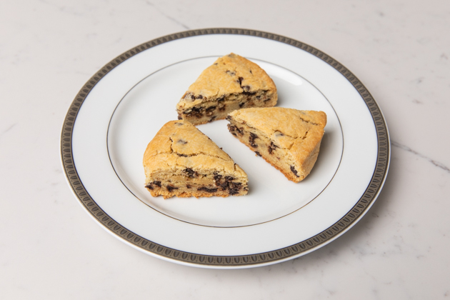 Gluten-free Chocolate Chip Scones, Healthy Breakfast Ideas, Gluten-free recipes, Gluten and Dairy-Free Chocolate Chip Scones, Gluten-free Living, Food Blogger, Foodie, Mouth Watering Recipes, Healthy Eating, Organic Eating, Gluten Free Baking, High Tea Scones, Easy and Healthy Recipes, healthy brunch ideas, picnic menu, #organicliving #glutenfreerecipe #glutenfreebaking #organiceating #HighTea #glutenfreebreakfastideas #brunch #foodie #chocolatechipscones | Chocolate Chip Scones by popular L.A. lifestyle blog, Pretty Little Shoppers: image of chocolate chip scones on a white ceramic plate. 
