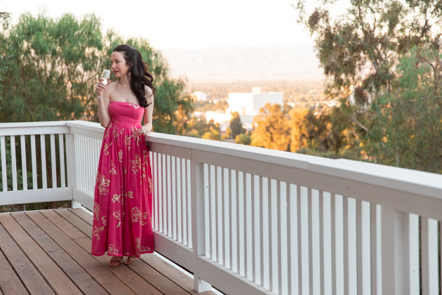 Date Night at Home: Strapless Dress | Strapless Dress by popular L.A. fashion blog, Pretty Little Shoppers: image of a woman standing outside on a balcony and wearing a Free People Women's Baja Babe Midi Dress.