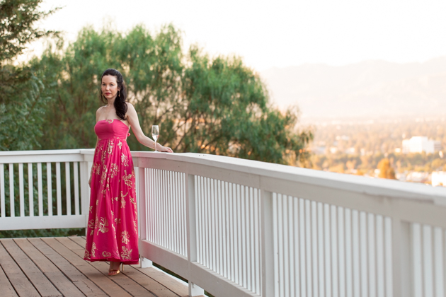 What to wear for a Date Night at Home | Strapless Dress by popular L.A. fashion blog, Pretty Little Shoppers: image of a woman standing outside on a balcony and wearing a Free People Women's Baja Babe Midi Dress.