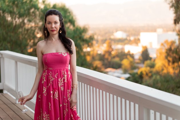 Lisa Valerie Morgan wears Free People Strapless Dress | Strapless Dress by popular L.A. fashion blog, Pretty Little Shoppers: image of a woman standing outside on a balcony and wearing a Free People Women's Baja Babe Midi Dress.