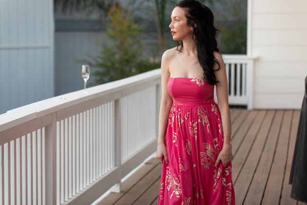 Free People Strapless Dress | Strapless Dress by popular L.A. fashion blog, Pretty Little Shoppers: image of a woman standing outside on a balcony and wearing a Free People Women's Baja Babe Midi Dress.