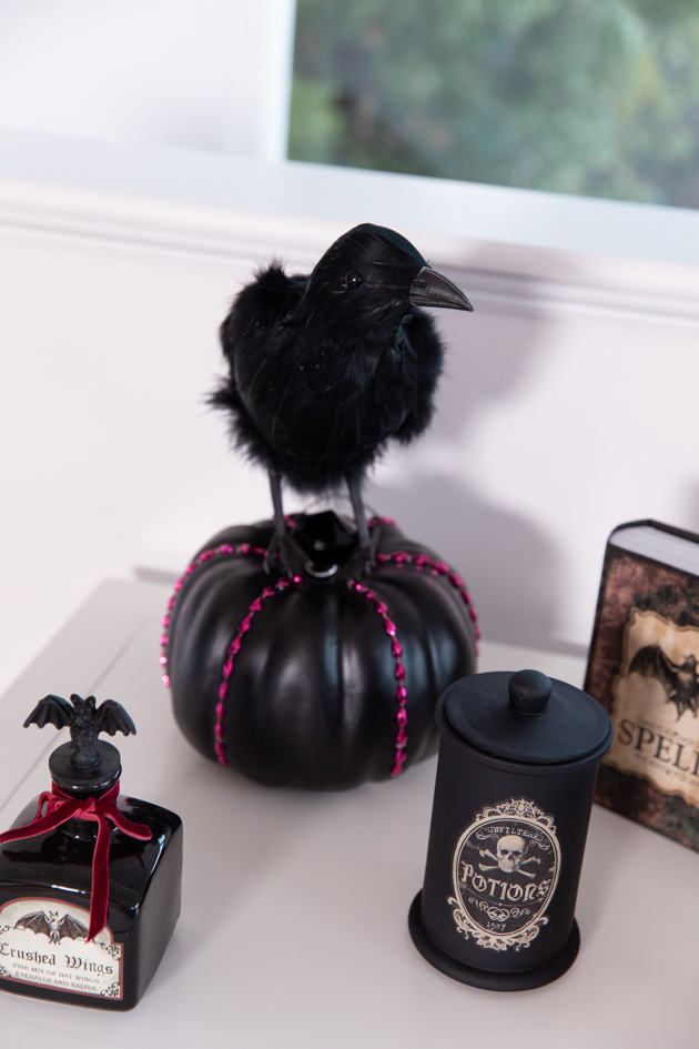 Celebrating Halloween In My New House, Halloween Ideas, How to Celebrate Halloween at Home, Halloween Ideas during Covid-19 Quarantine, Los Angeles Lifestyle Blogger, Pretty Little Shoppers Blog, Halloween Decorations #Halloween2020 | Cheese Platter by popular LA lifestyle blog, Pretty Little Shoppers: image of a black crow, black pumpkin, and black apothecary bottles. 