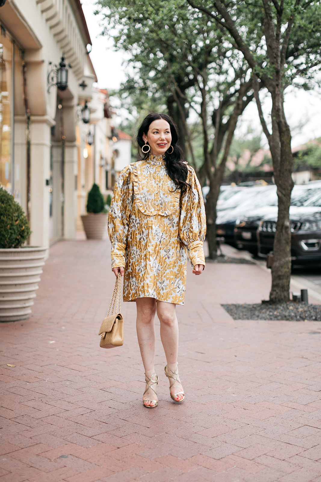 Sister Jane Cocktail Dress, Chanel Bag, Jimmy Choo Sandals | Cocktail Dress by popular Dallas fashion blog, Pretty Little Shoppers: image of a woman walking outside on a brick paved sidewalk and wearing a Sister Jane Cocktail Dress, Chanel Bag, Jimmy Choo Sandals, and Ettika earrings.