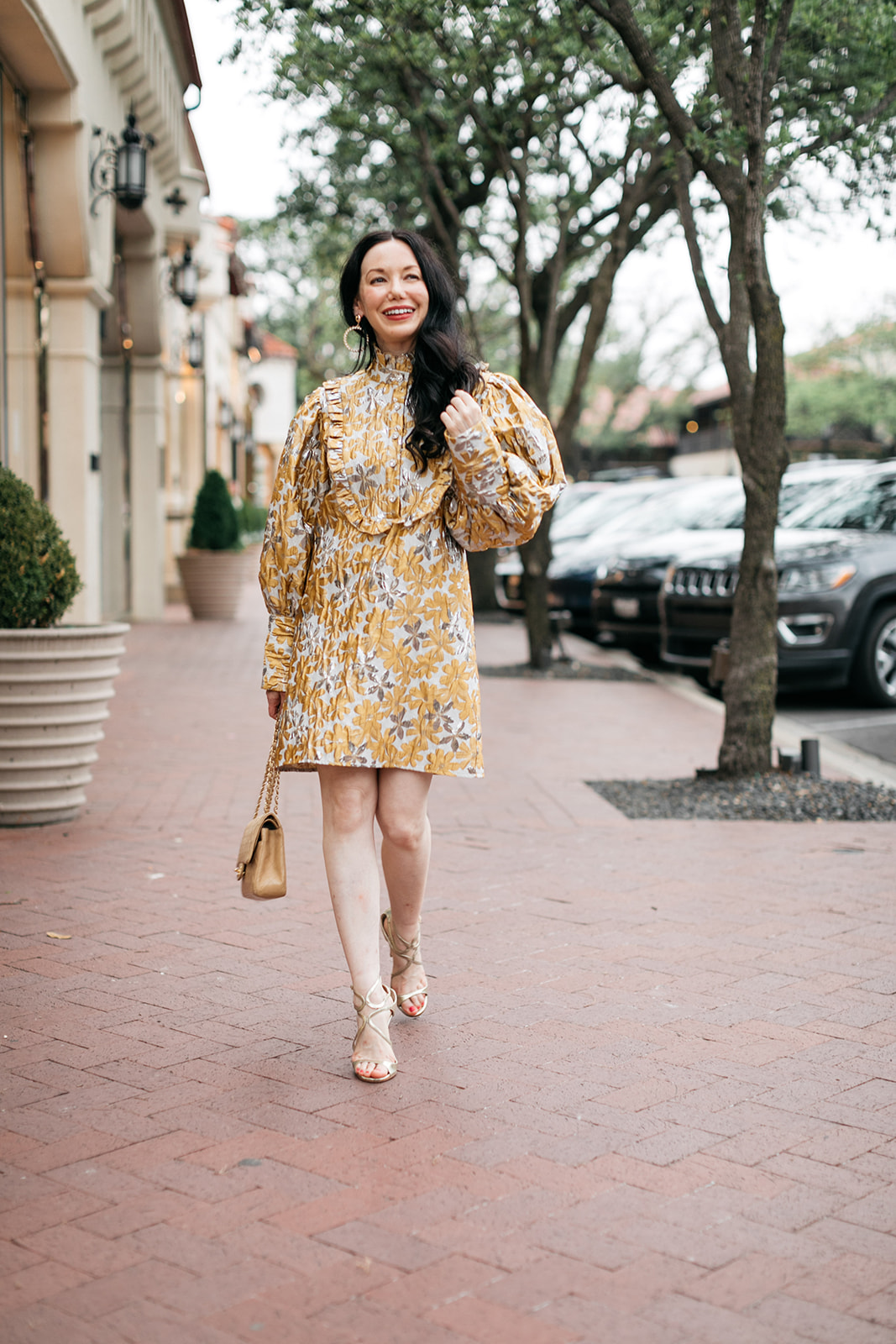 Sister Jane Cocktail Dress, Chanel Bag, Jimmy Choo Sandals, Ettika earrings, Highland Park Village | Cocktail Dress by popular Dallas fashion blog, Pretty Little Shoppers: image of a woman walking outside on a brick paved sidewalk and wearing a Sister Jane Cocktail Dress, Chanel Bag, Jimmy Choo Sandals, and Ettika earrings.