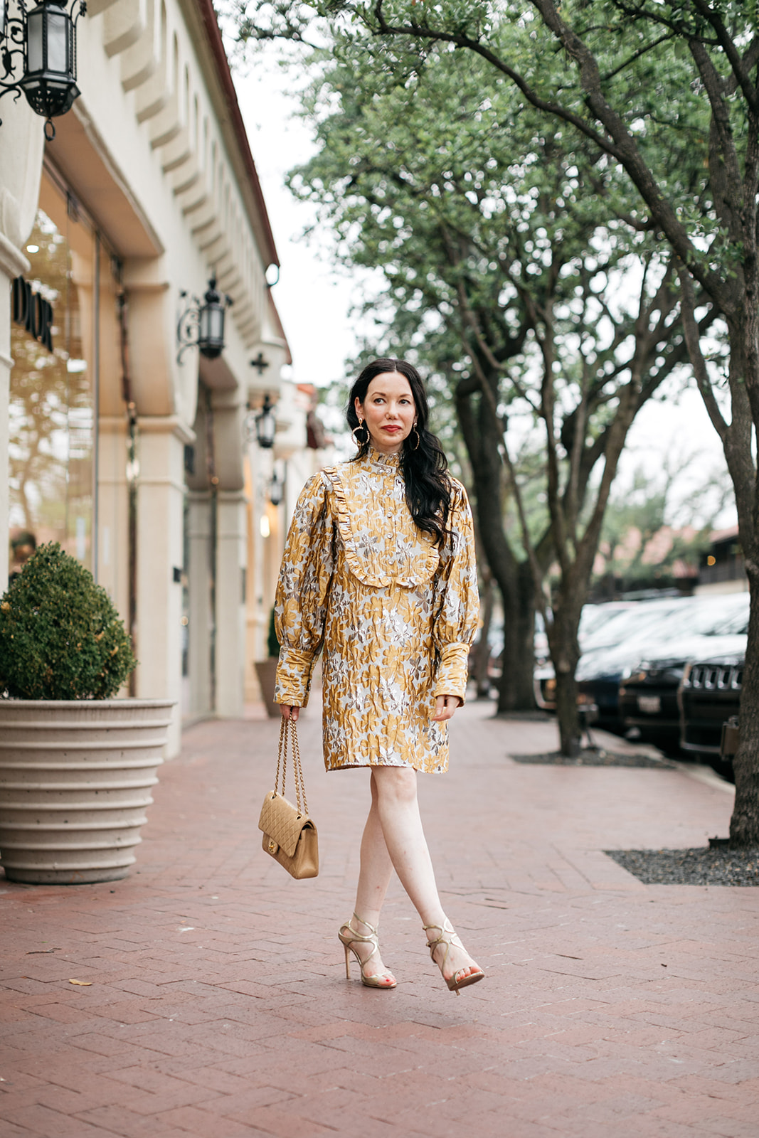 Sister Jane Cocktail Dress, Chanel Bag, Jimmy Choo Sandals | Cocktail Dress by popular Dallas fashion blog, Pretty Little Shoppers: image of a woman walking outside on a brick paved sidewalk and wearing a Sister Jane Cocktail Dress, Chanel Bag, Jimmy Choo Sandals, and Ettika earrings.