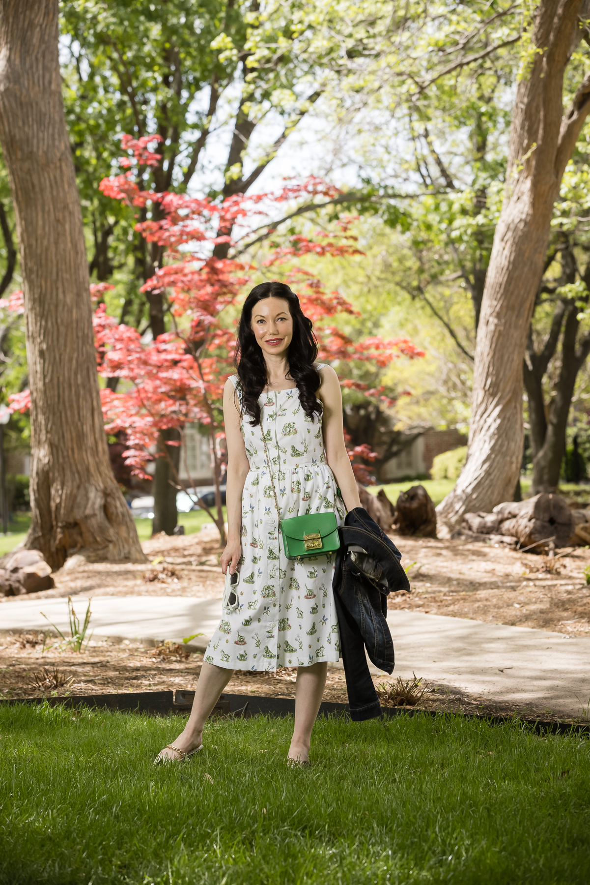 Sarah Patrick Collection Newport Topiary Gardens Dress styled with Green mini Furla crossbody bag |Sarah Patrick Collection by popular Dallas fashion blog, Pretty Little Shoppers: image of a woman standing outside on some grass and wearing a Sarah Patrick Collection Newport Topiary Gardens Dress with Green Furla Crossbody Bag.