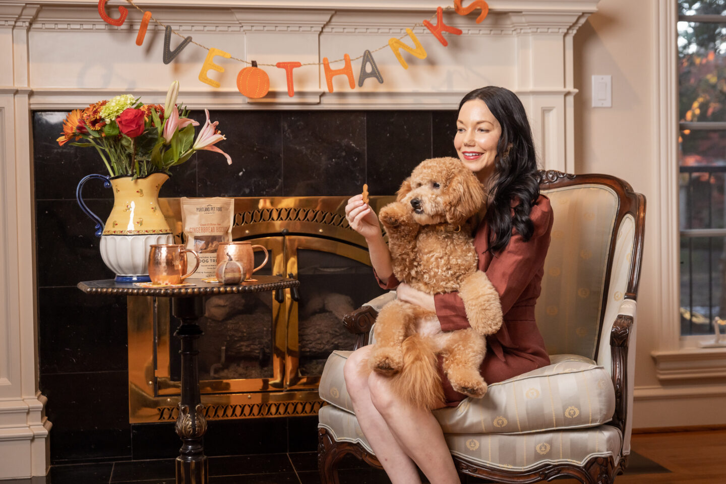 Mini Goldendoodle gets a gingerbread treat from Portland Pet Food Company.