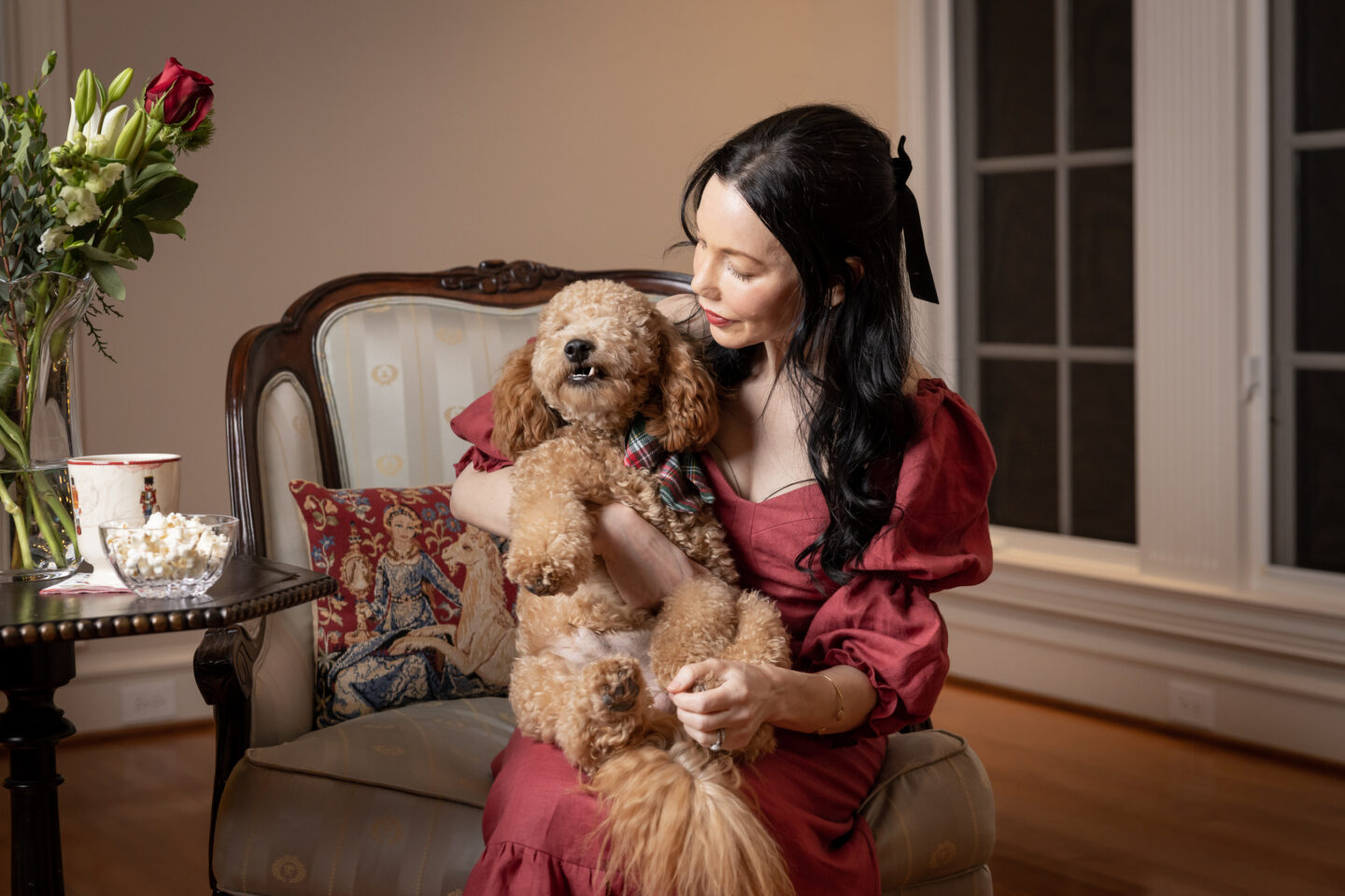Brunette Woman holds her Mini Goldendoodle Puppy