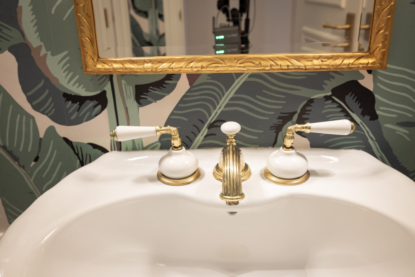Hollywood Regency Powder Room with Phylrich Hardware